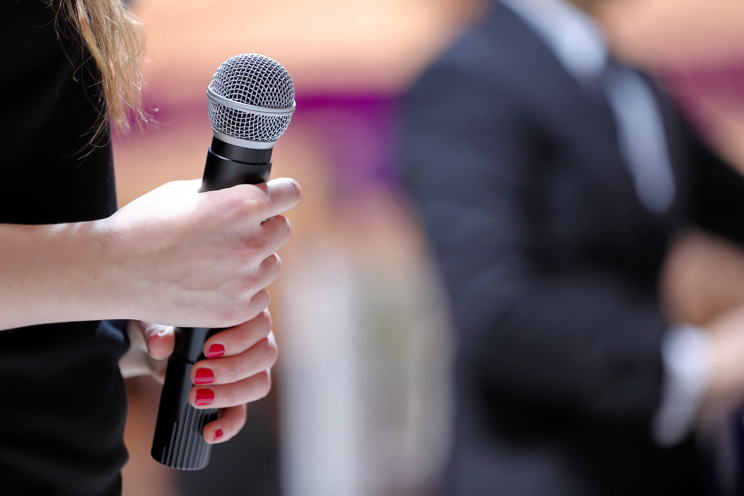 woman holding microphone